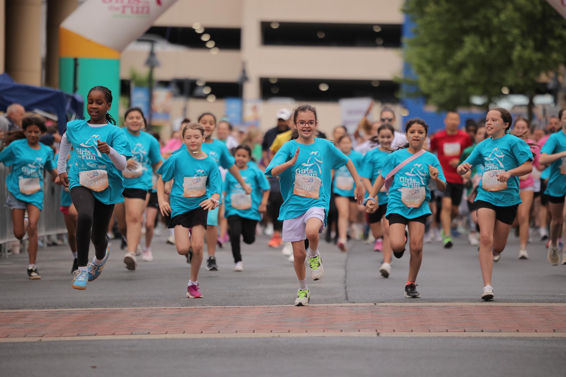 Group of Girls on the Run participants running at the 5K.