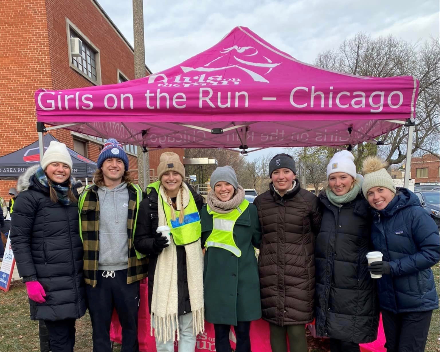 Lauren Duer, center, and the West Monroe team volunteering at a CARA Go Run with GOTRC
