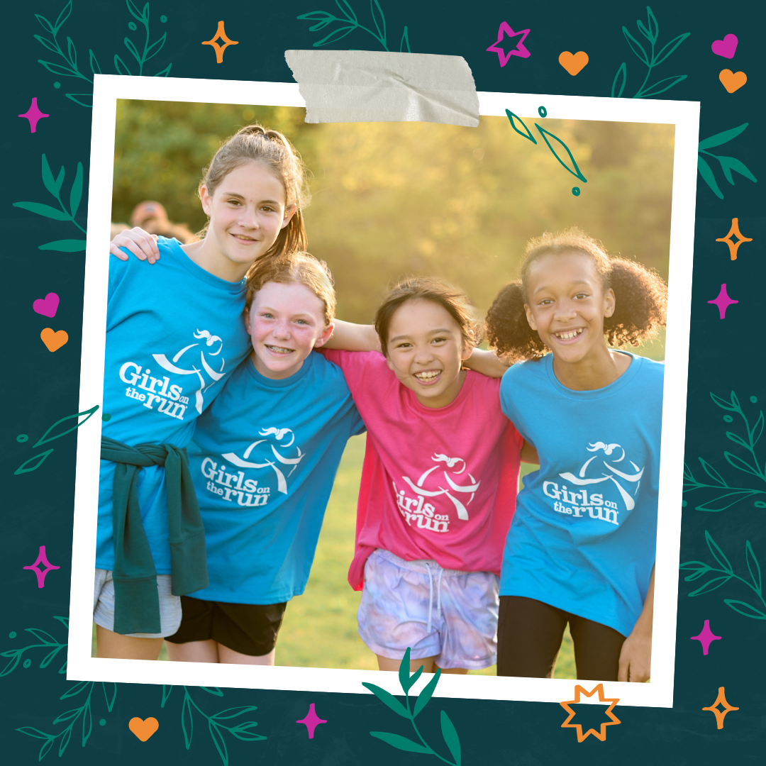 Girls on the Run participants stand back to back with a teammate smiling.